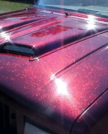 Rose Red Flake paint on hood of Ford Explorer.