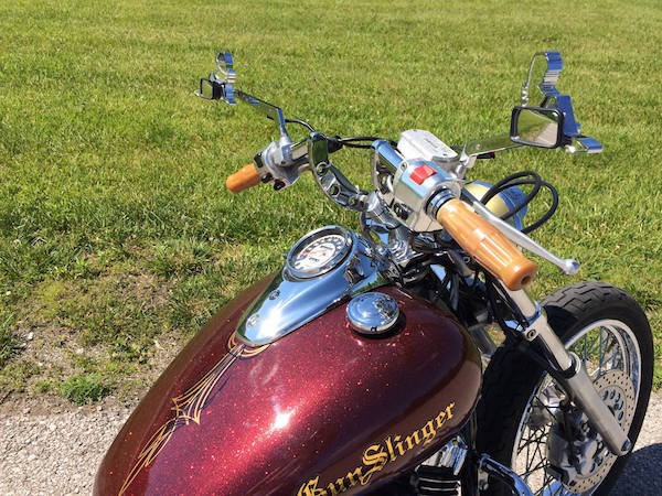 Close up of Gunslinger bike with gold metal flake custom paint.